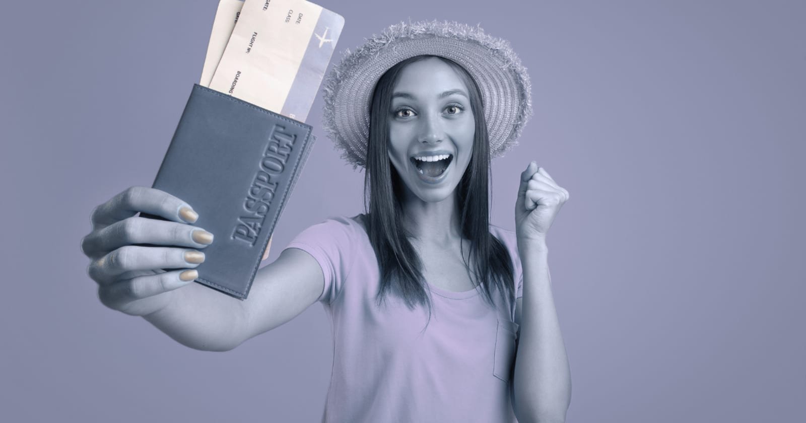 A traveller holding up a passport with boarding passes tucked inside